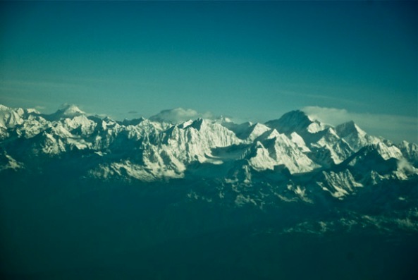 The numerous peaks and summits of the Himalaya, bathed in the warm rays of the morning sun