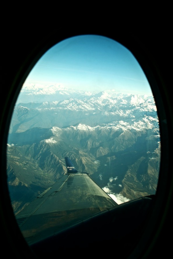 The first glimpse of the snow-capped Himalaya as we ascend - Buddha Air peeping through!