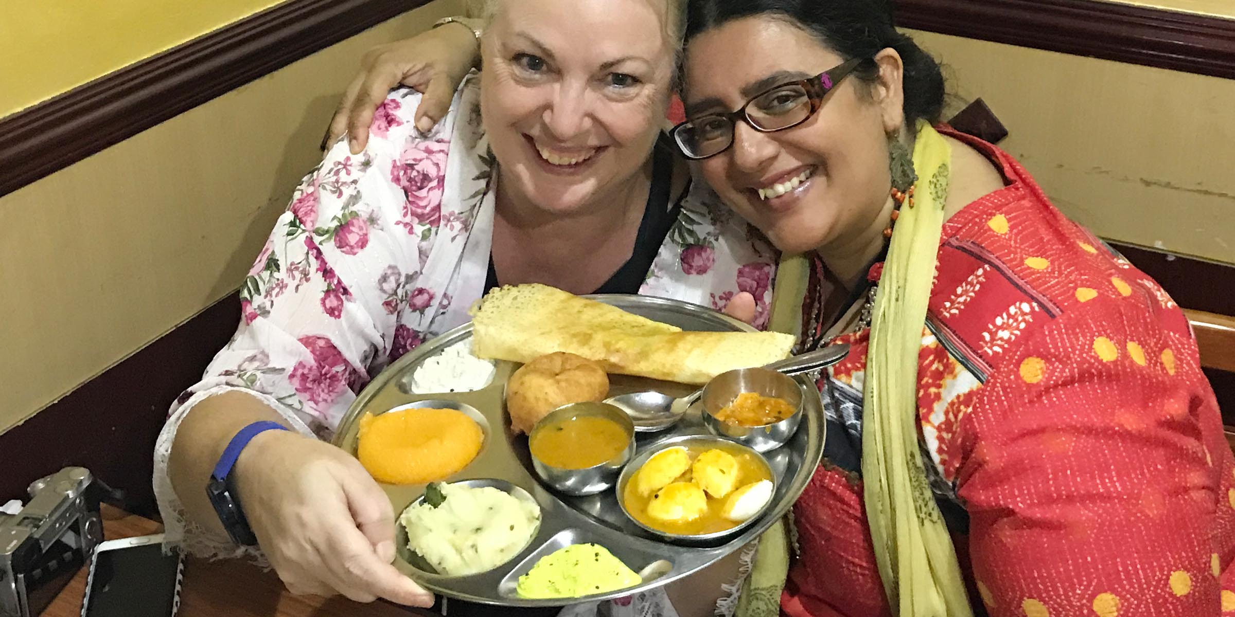 Debbie Rogers and Ishita B Saha on a food tour with Frying Pan Adventures