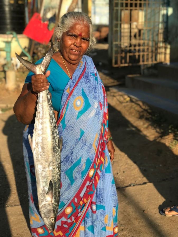 A fisherwoman in Kovalam fish market in Chennai