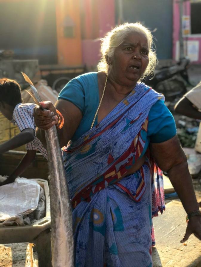 A fisherwoman in Kovalam fish market in Chennai