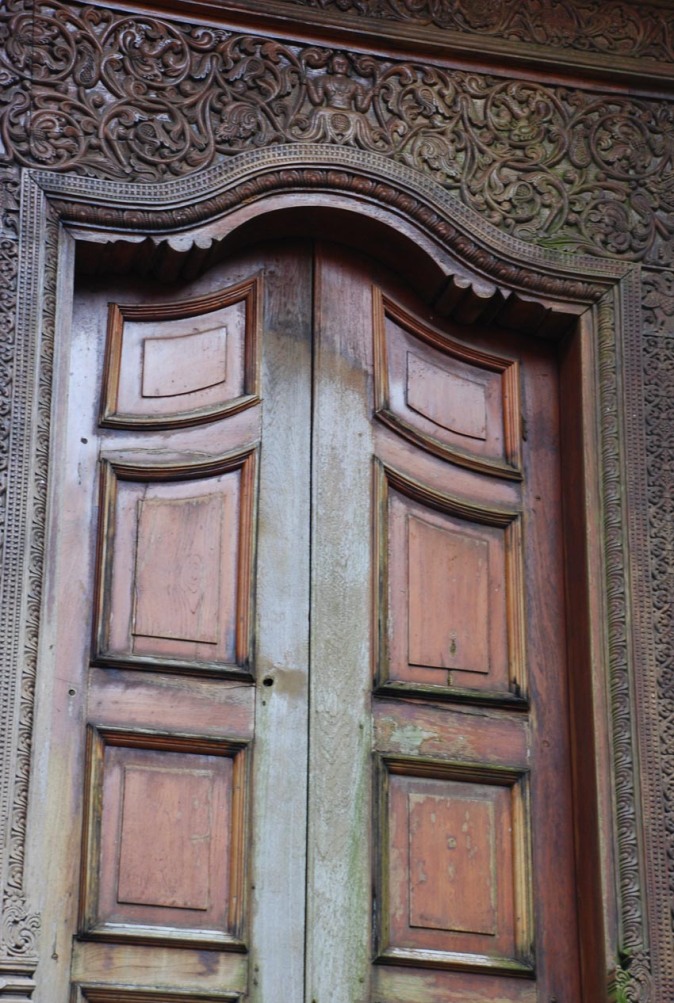 Carvings on wooden door in Temple of the Tooth Relic