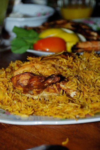 Dajaj or Chicken cooked with Yellow Rice simmered in chicken stock and special Arabic spices and dry lemon